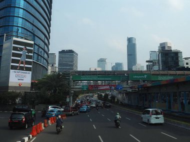 JAKARTA, INDONESIA - August 24, 2018: Traffic on Jalan Sudirman (Sudirman road).