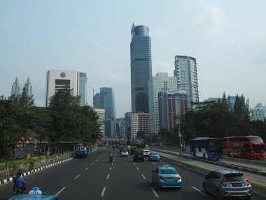 JAKARTA, INDONESIA - August 24, 2018: Traffic on Jalan Sudirman (Sudirman road).