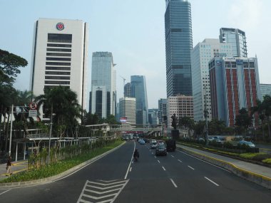 JAKARTA, INDONESIA - August 24, 2018: Traffic on Jalan Sudirman (Sudirman road).