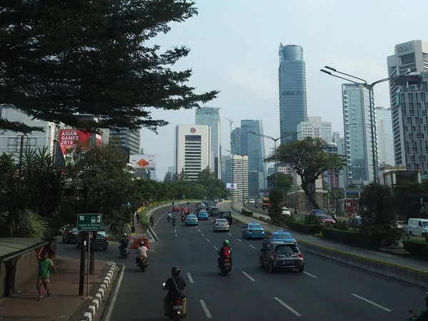 JAKARTA, INDONESIA - August 24, 2018: Traffic on Jalan Sudirman (Sudirman road).