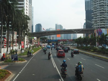 JAKARTA, INDONESIA - August 24, 2018: Traffic on Jalan Sudirman around Karet Flyover.