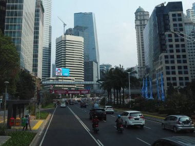 JAKARTA, INDONESIA - August 24, 2018: Traffic on Jalan Sudirman (Sudirman road).
