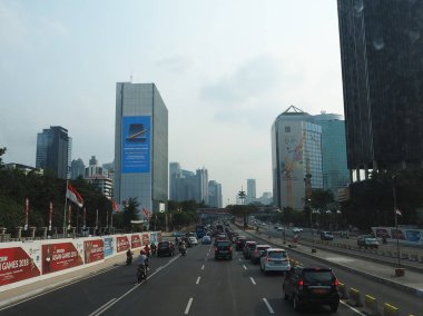 JAKARTA, INDONESIA - August 24, 2018: Traffic on Jalan Sudirman (Sudirman road).