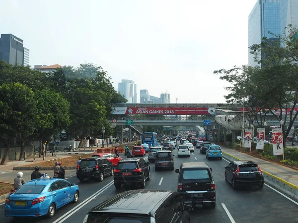 JAKARTA, INDONESIA - August 24, 2018: Traffic on Jalan Sudirman (Sudirman road).