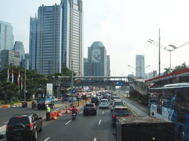 JAKARTA, INDONESIA - August 24, 2018: Traffic on Jalan Sudirman around Sudirman Central Business District (SCBD).