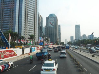 JAKARTA, INDONESIA - August 24, 2018: Traffic on Jalan Sudirman around Sudirman Central Business District (SCBD).