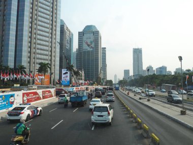 JAKARTA, INDONESIA - August 24, 2018: Traffic on Jalan Sudirman around Sudirman Central Business District (SCBD).