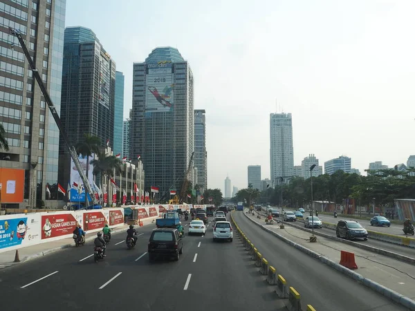 JAKARTA, INDONESIA - August 24, 2018: Traffic on Jalan Sudirman around Sudirman Central Business District (SCBD).