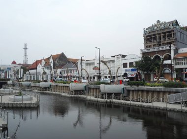 JAKARTA, INDONESIA - August 7, 2018: Vintage Dutch colonial buildings beside Krukut River on Kali Besar, Kota Tua.