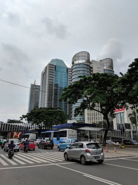 Jakarta, Indonesia - February 16, 2019: Traffic on Sudirman street in Senayan district.