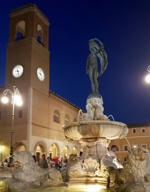 The clock tower sited in the Senigallia's historical center in central Italy clipart