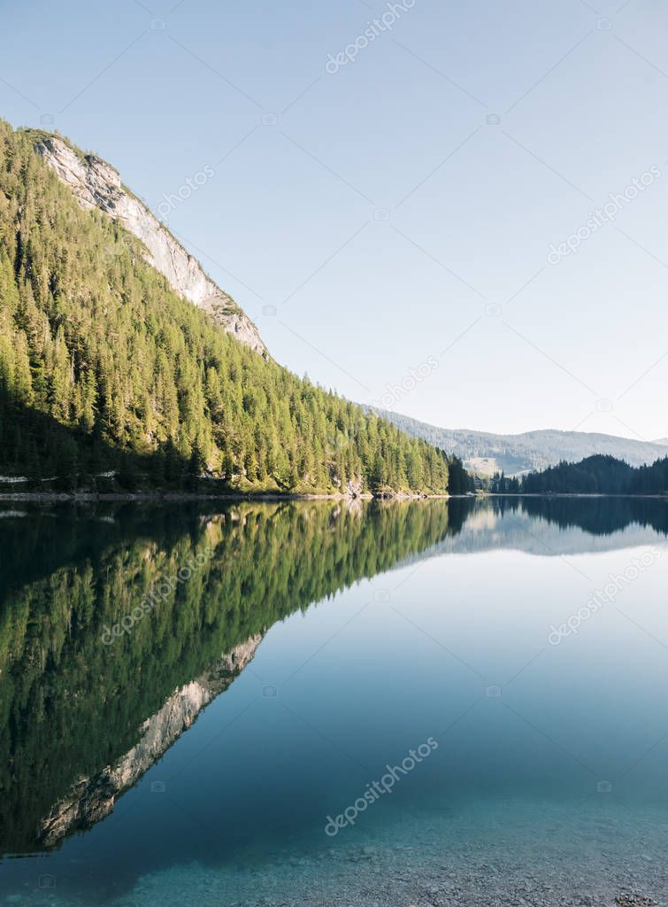 scenic view of fascinating clear lake in mountains, Lago di Braies, Italy