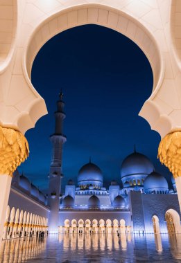 famous and beautiful Sheikh Zayed Mosque architecture, view through arch, Abu Dabi, UAE clipart