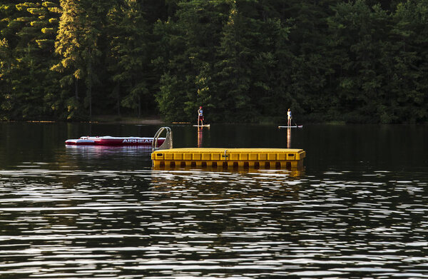 lake with a large wooden platform in Maine, USA