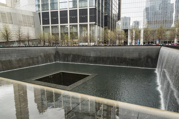 Names of victims inscribed on the bronze walls surrounding the south tower footprint at the 9 11 Memorial — Stock Photo, Image