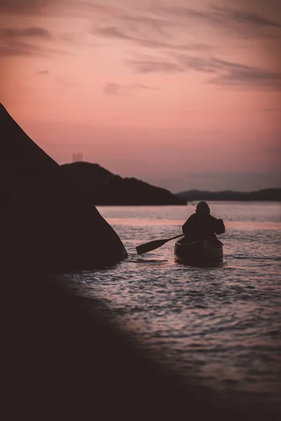 Canoeing on a late night with a sunset