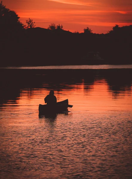 Canoeing on a late night with a sunset