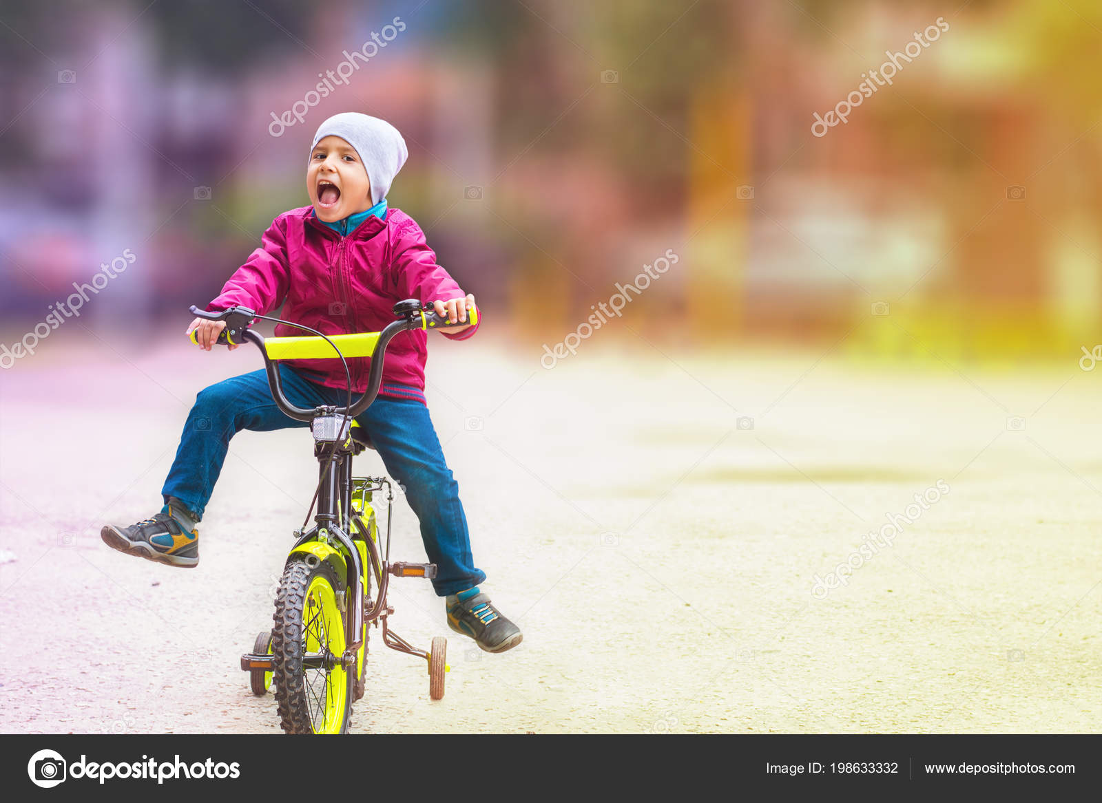 boy learning to ride bike