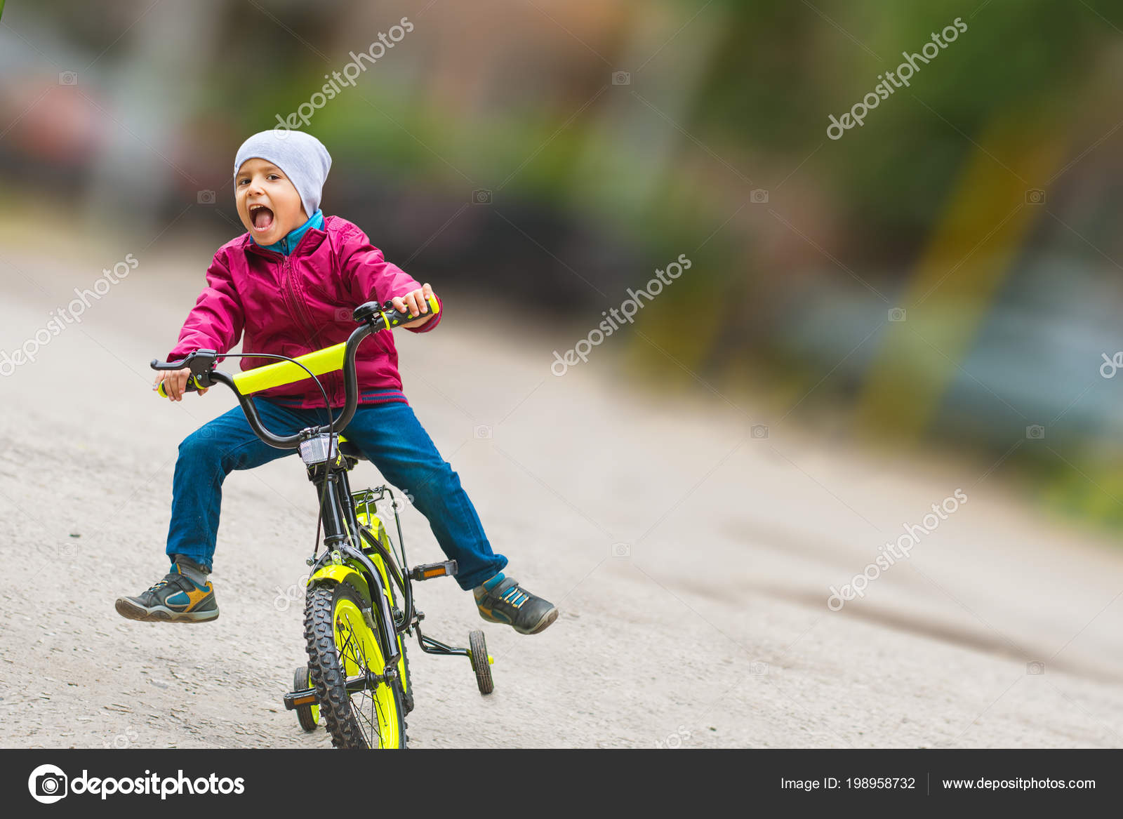 boy learning to ride bike