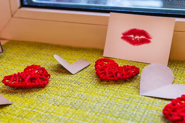 hearts and a card with a lip print