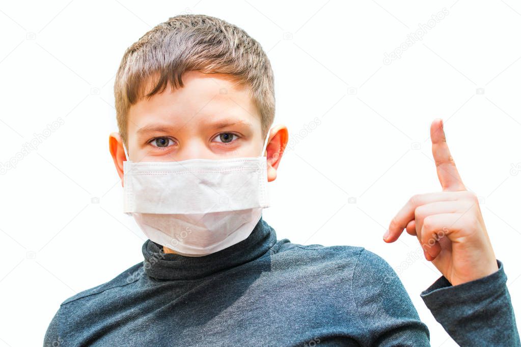teen boy in medical mask shows gesture. isolated background