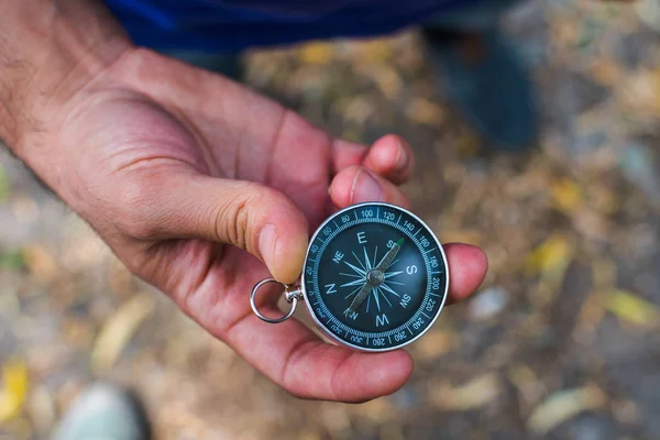 Compass in hand. the view from the top — Stock Photo, Image