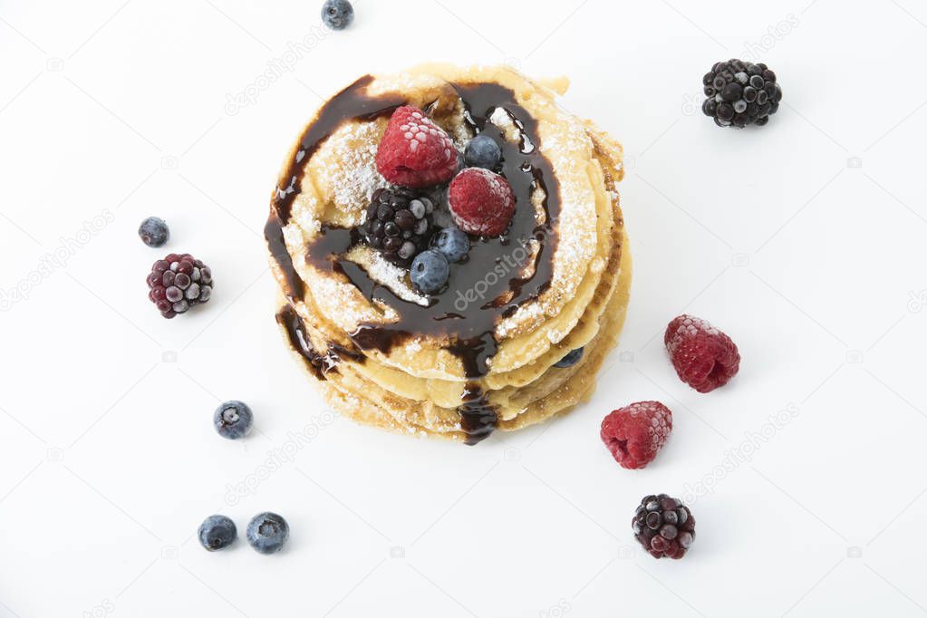 pancakes with raspberry, bilberry, blackberry and chocolate sauce