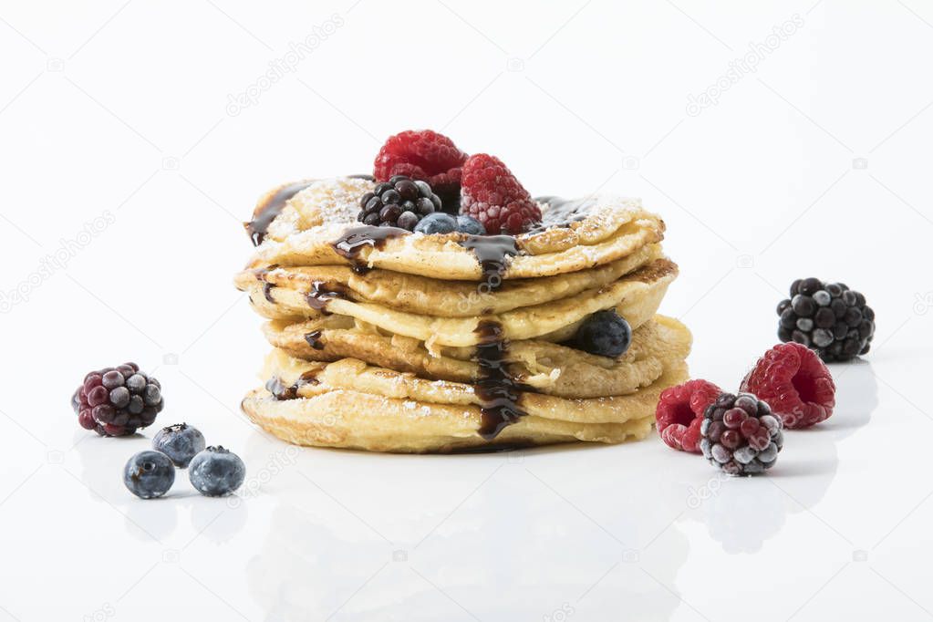 pancakes with raspberry, bilberry, blackberry and chocolate sauce