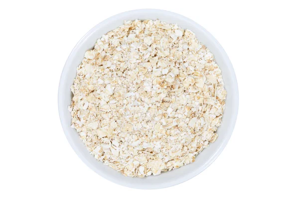 Oatmeal oats from above bowl isolated on white — Stock Photo, Image