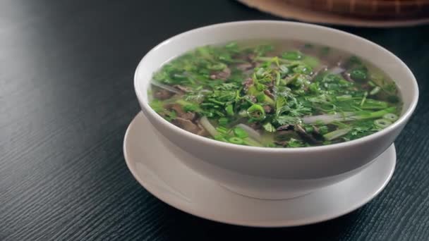 Vietnamese soup Pho Bo with chilli pepper — Stock Video