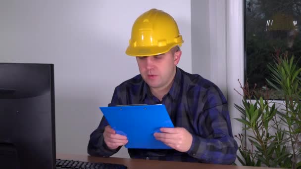 Young successful construction supervisor realtor in office doing work at computer — Stock Video