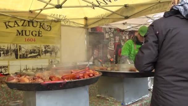 Cooker cook food in huge pans and people in outdoor kitchen. steadicam — Stock Video