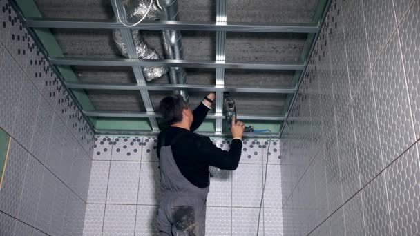 Worker Drill Hole To Fix Ceiling Profiles Stock Video C Sauletas
