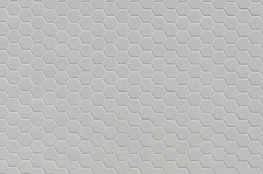 Arkaplan olarak altıgenlerin basit bir beyaz doku deseni