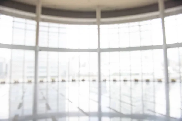 stock image Blur background interior view looking out toward to empty office lobby and entrance doors and glass curtain wall