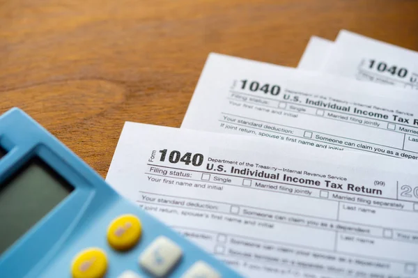 U.S. Individual income tax return. tax form 1040. Tax form business financial concept and calculator