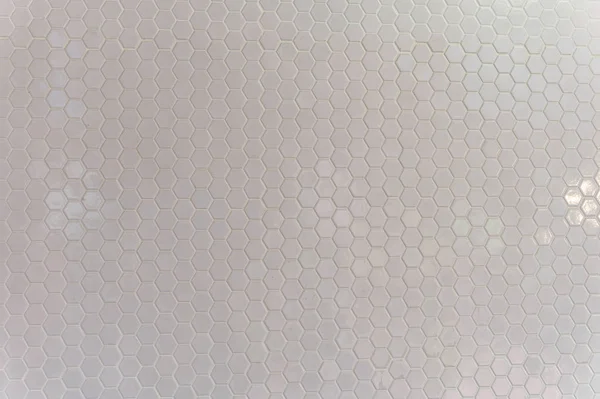 Um padrão simples de textura branca de hexágonos como fundo — Fotografia de Stock