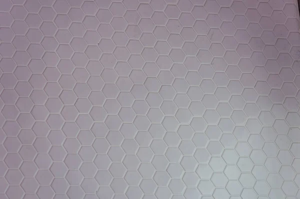 Um padrão simples de textura branca de hexágonos como fundo — Fotografia de Stock