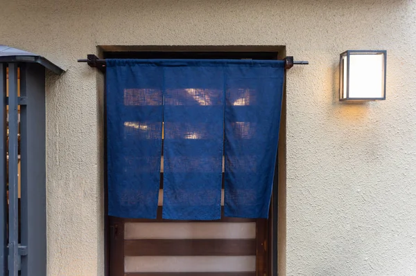 The curtain-like fabric that hangs in front of traditional Japan