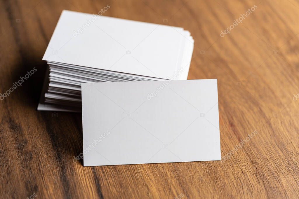 Business cards blank mockup on wooden background