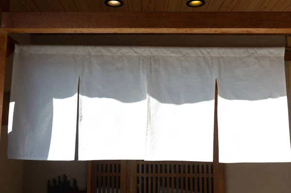 The curtain-like fabric that hangs in front of traditional Japanese restaurants and shops not only serves as a signboard, but holds a larger meaning,