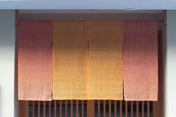 The curtain-like fabric that hangs in front of traditional Japanese restaurants and shops not only serves as a signboard, but holds a larger meaning,