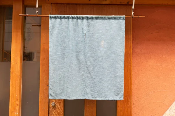 The curtain-like fabric that hangs in front of traditional Japanese restaurants and shops not only serves as a signboard, but holds a larger meaning,