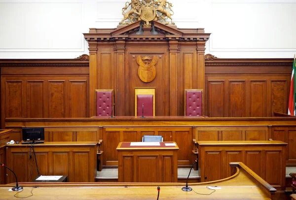 Empty courtroom, with old wooden panelling