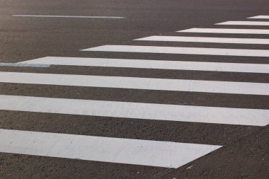 White . line on city asphalt road background. pedestrian crossing. Copy space for text. clipart