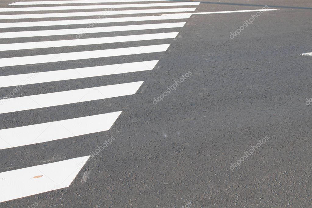 White . line on city asphalt road background. pedestrian crossing. Copy space for text.