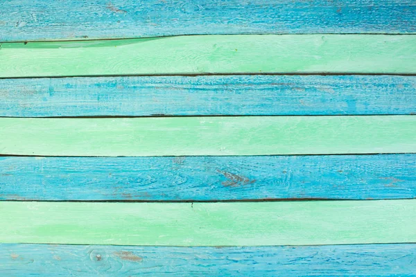 Ahşap doku yaz arka plan. Parke, ahşap tahıl, organik malzeme grunge tarzı. yeşil ve mavi ahşap yüzey üstten görünüm. Ahşap masa üstü görünümü