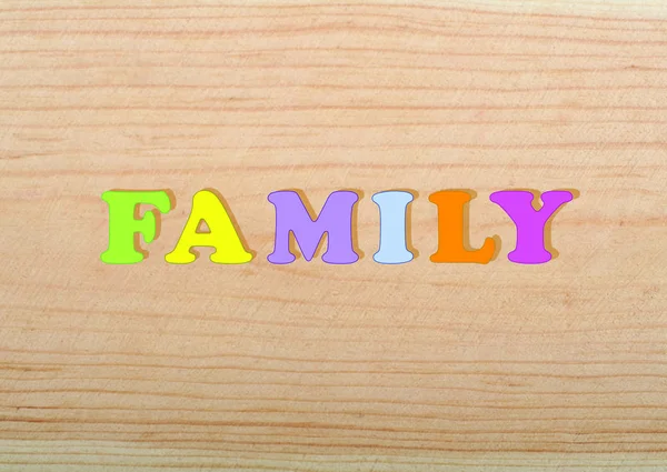 Família Palavra Sobre Fundo Madeira Composto Por Colorido Abc Alfabeto — Fotografia de Stock