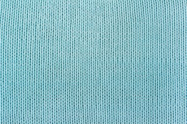 Süveter ya da atkı kumaş dokusu büyük örgü. Örülmüş forma ve kabartma desenli. Yün el yapımı makine, el yapımı.