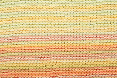 Süveter ya da atkı kumaş dokusu büyük örgü. Örülmüş forma ve kabartma desenli. Yün el yapımı makine, el yapımı.